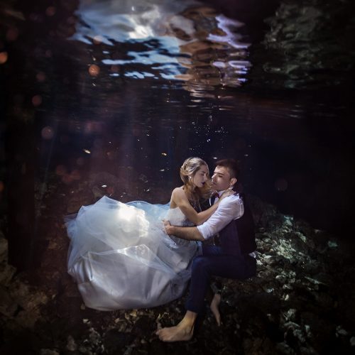 Bride and groom underwater in cenote TTD