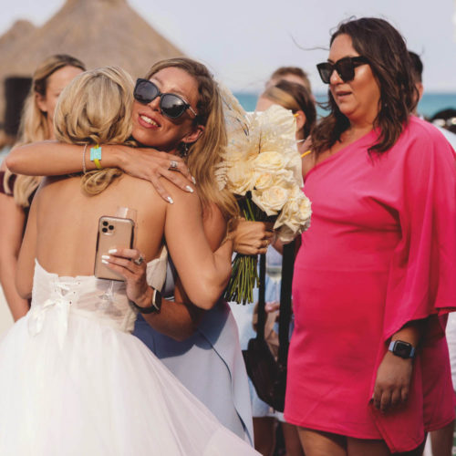 Bride emotionally hugging guests at iberostar paraiso beach resort