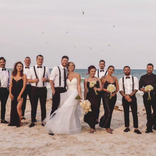 Casual photo of bridal party on the beach at iberostar paraiso beach resort