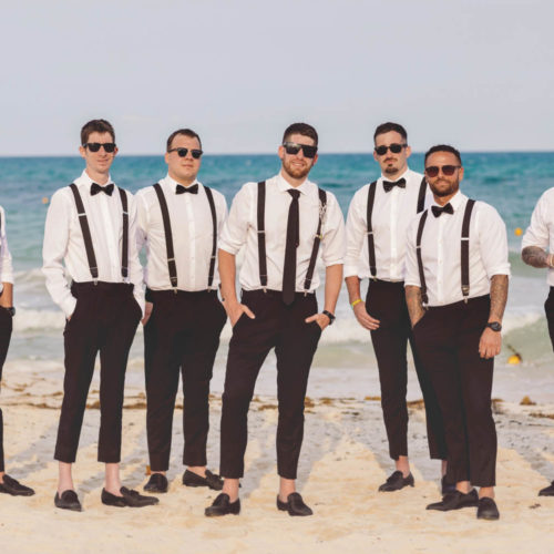Groomsmen on the beach in formal portrait at iberostar paraiso beach resort