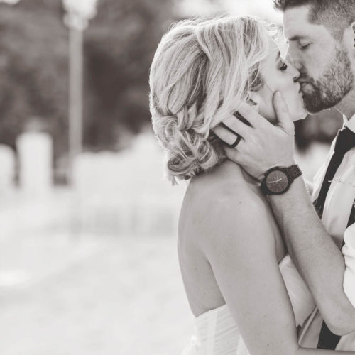Sexy kiss in black and white with bride and groom