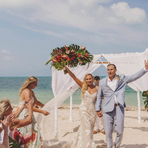 Jamie and Anthony celebrating after getting married at Finest Playa Mujeres