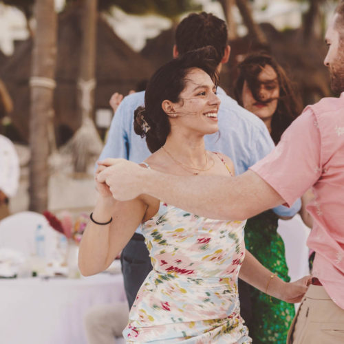 Guests dancing and smiling at wedding reception at Finest Playa Mujeres