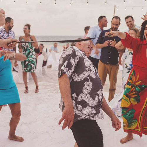 Guests dancing at wedding reception.