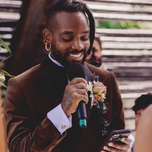 Close up of groom saying vows at wedding