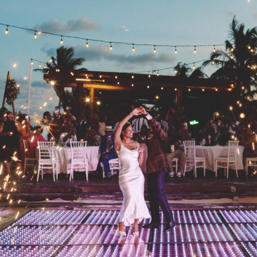 Josh twirls Morgan during first dance outside a Royalton Riviera Cancun Resort