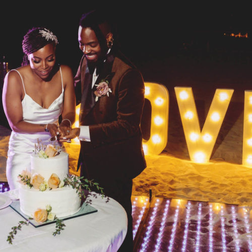 Morgan and Josh cutting the cake at Royalton Riviera Cancun Resort