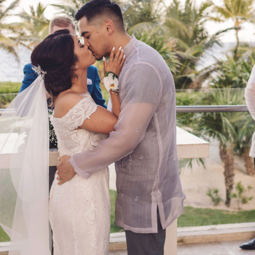 Bride and grooms first kiss at the chapel at Royalton Riviera Cancun