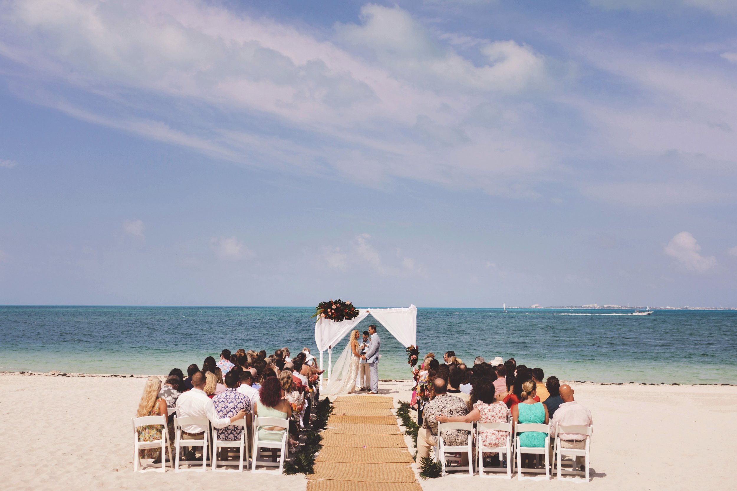 Unplugged wedding ceremony on beach in Cancun.