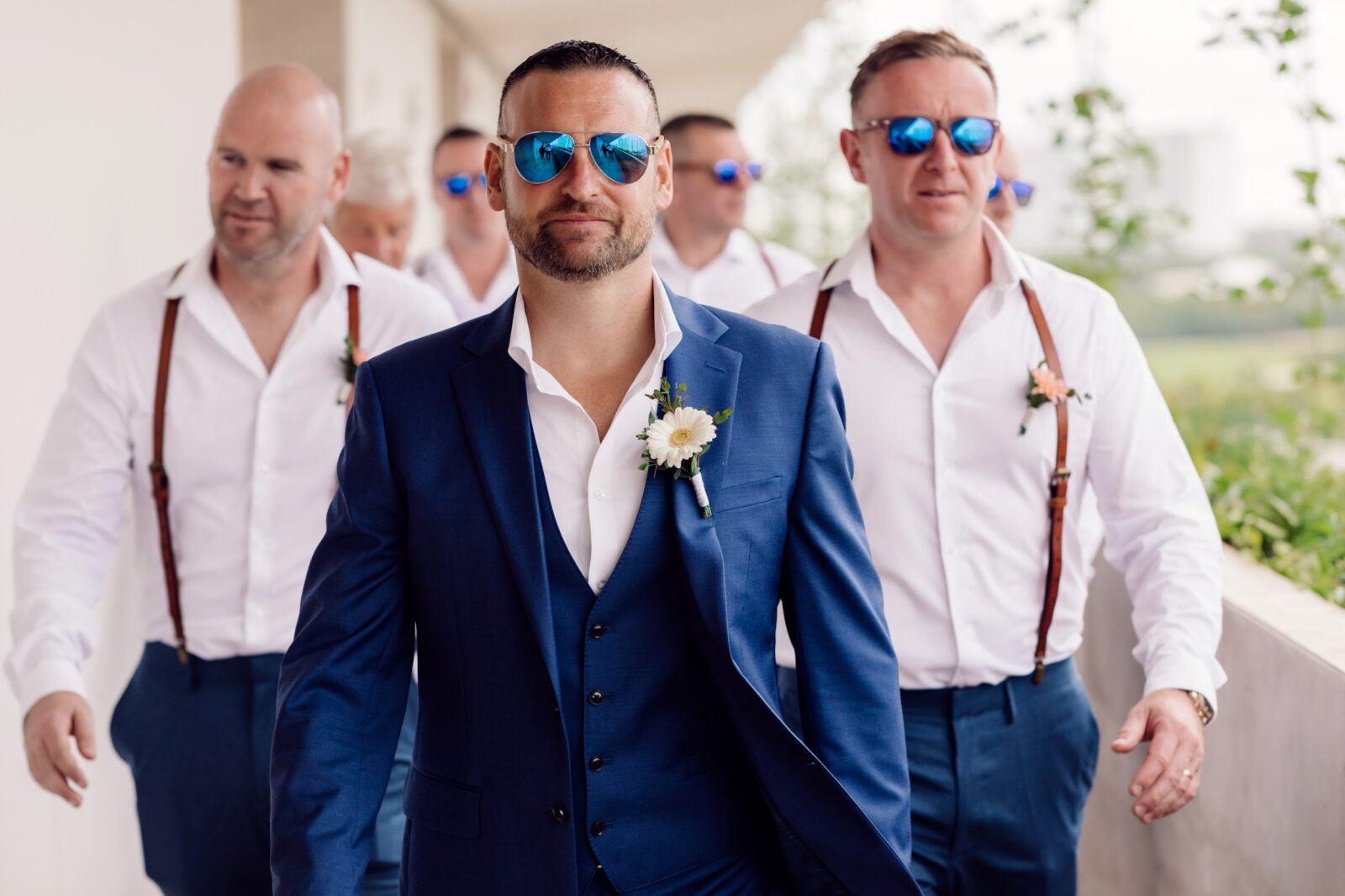 Guys walking to wedding in Cancun